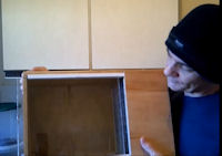 A simple wooden box turned into a hospital cage, suitable for a small bird